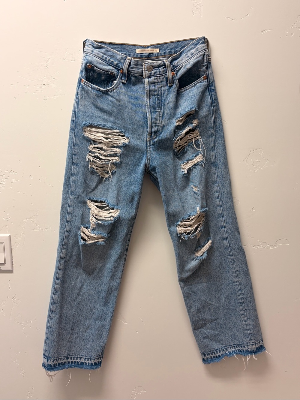 High-Rise Distressed Light Wash Levi Jeans